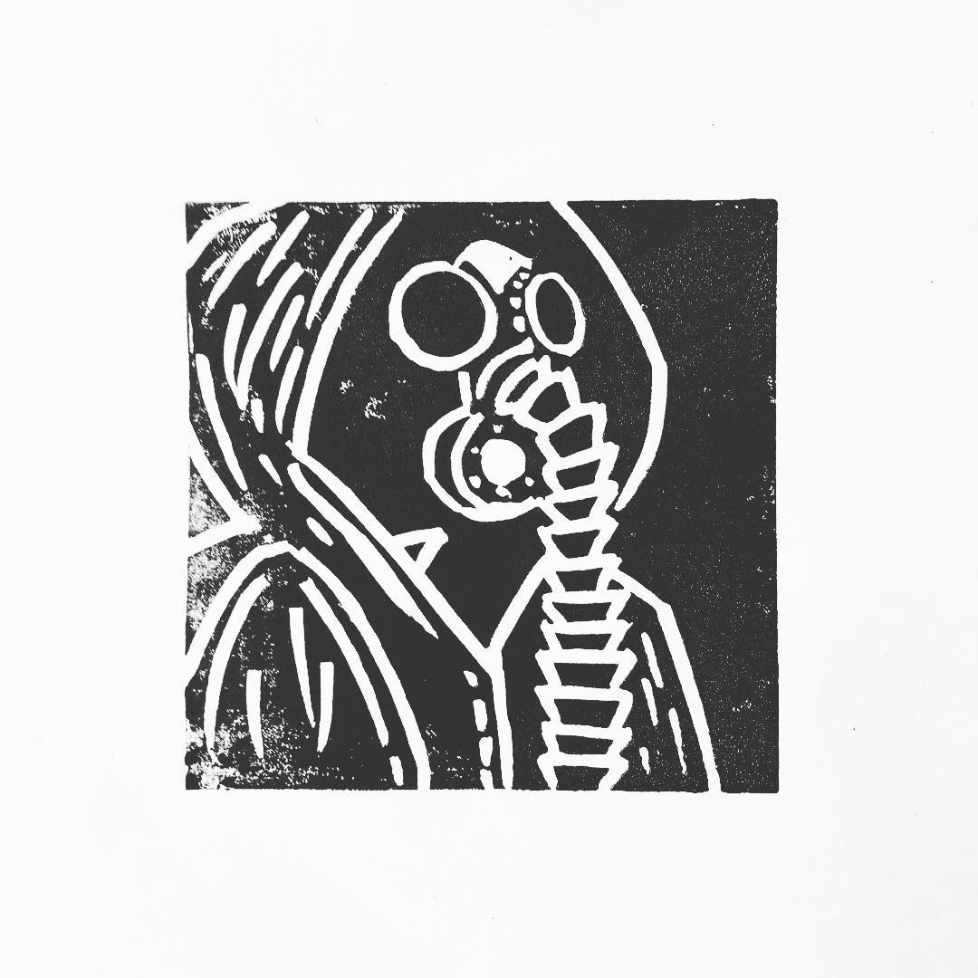 Lino print: a hooded figure wearing a gas mask with a ribbed breathing hose