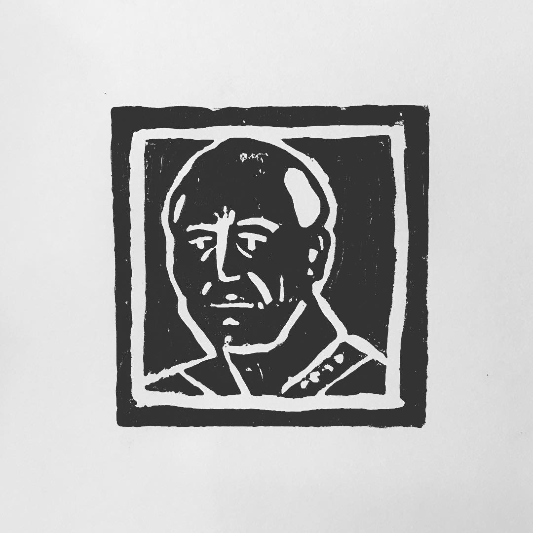 Lino print: portrait of a bald man in a high-collared uniform, after Jean-Luc Picard