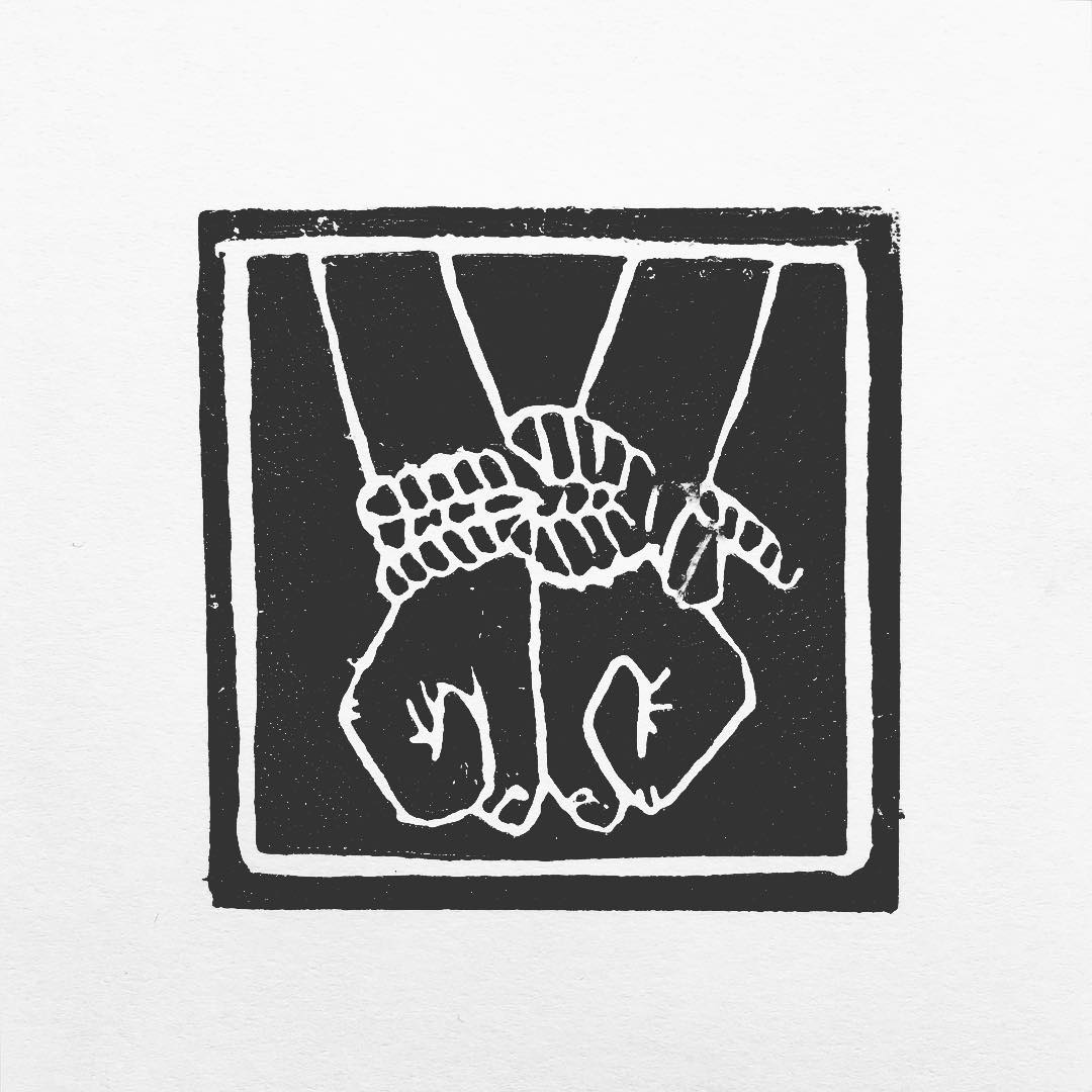 Lino print: two pairs of hands bound together at the wrists with rope