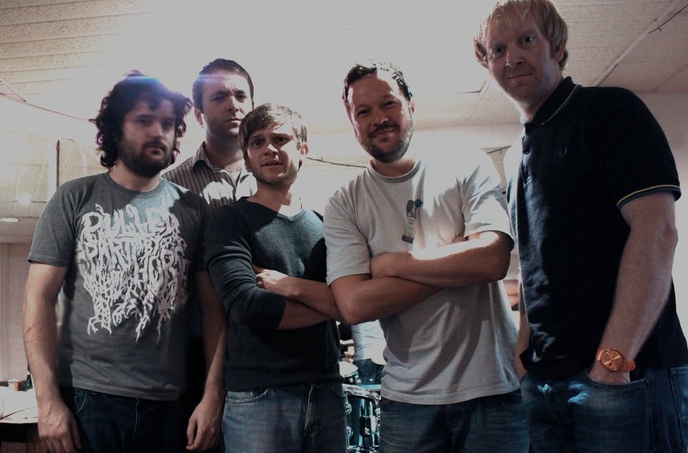 The band lineup with Theston